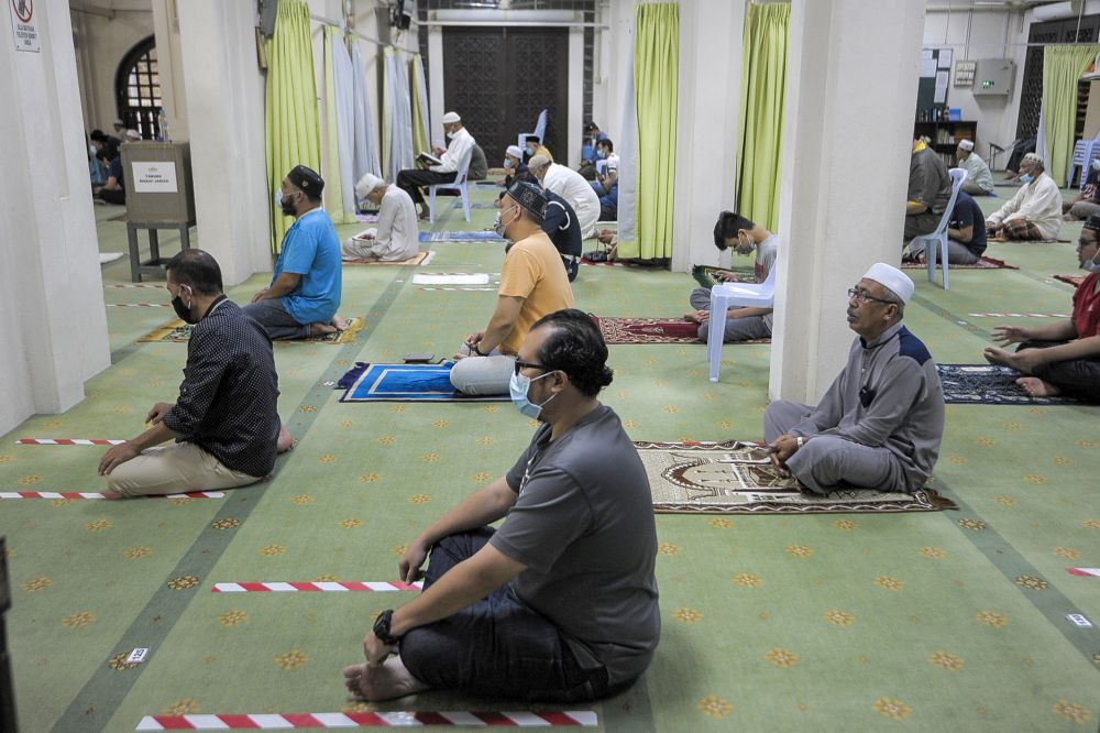 Malaysian Muslims observe social distancing while performing Friday prayers at the At-Taqwa Mosque during recovery movement control order in Kuala Lumpur June 12, 2020. u00e2u20acu201d Picture by Shafwan Zaidonn