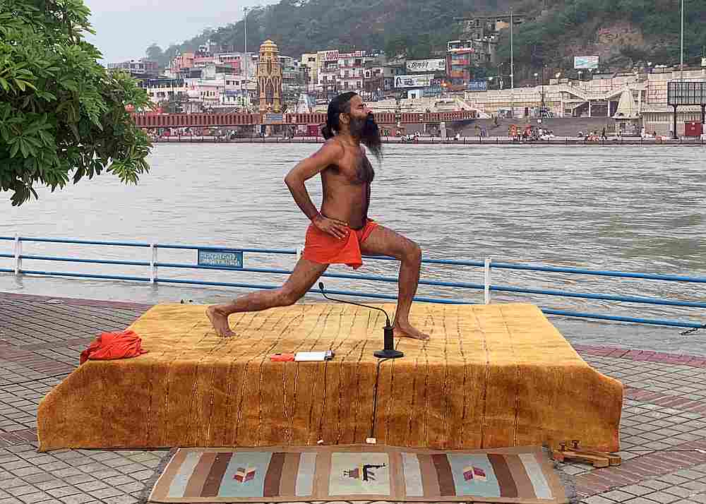 India's yoga guru Baba Ramdev performs yoga on the banks of the river Ganges ahead of International Yoga day, in the northern town of Haridwar, India June 19, 2020. u00e2u20acu201d Reuters pic