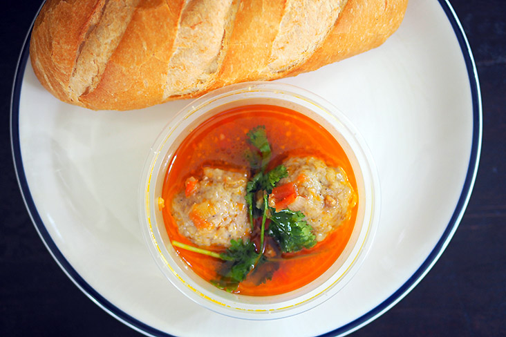 The pork dumpling soup may not look like much but the broth has a sweet taste from the tomatoes and the chunky meatball has a hidden quail's egg inside.