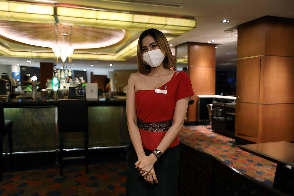 A hostess is seen at the bar of Royal Orchid Sheraton hotel, after the government eased some Covid-19 protective measures in Bangkok, Thailand June 26, 2020. u00e2u20acu201d Reuters pic