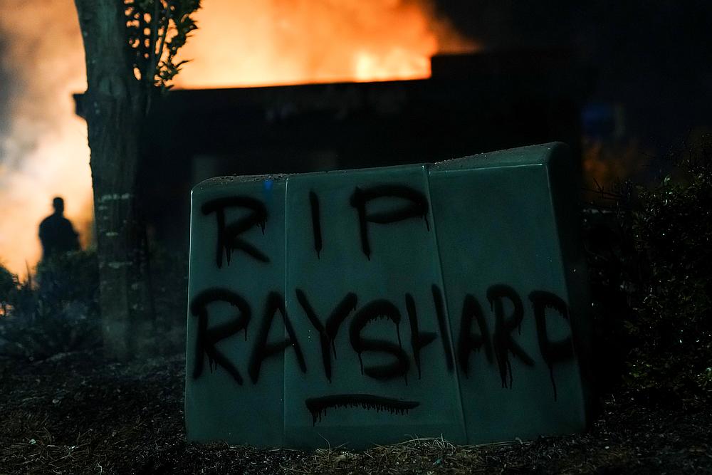 'RIP Rayshard' is seen written in spray paint as a Wendyu00e2u20acu2122s burns following a rally against racial inequality and the police shooting death of Rayshard Brooks, in Atlanta, Georgia June 13, 2020. u00e2u20acu201d Reuters pic