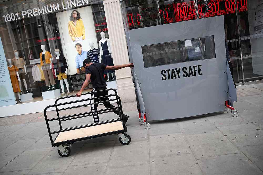 A store worker walks with equipment, amid the spread of Covid-19 in Oxford Street in London, Britain June 14, 2020. u00e2u20acu201d Reuters pic