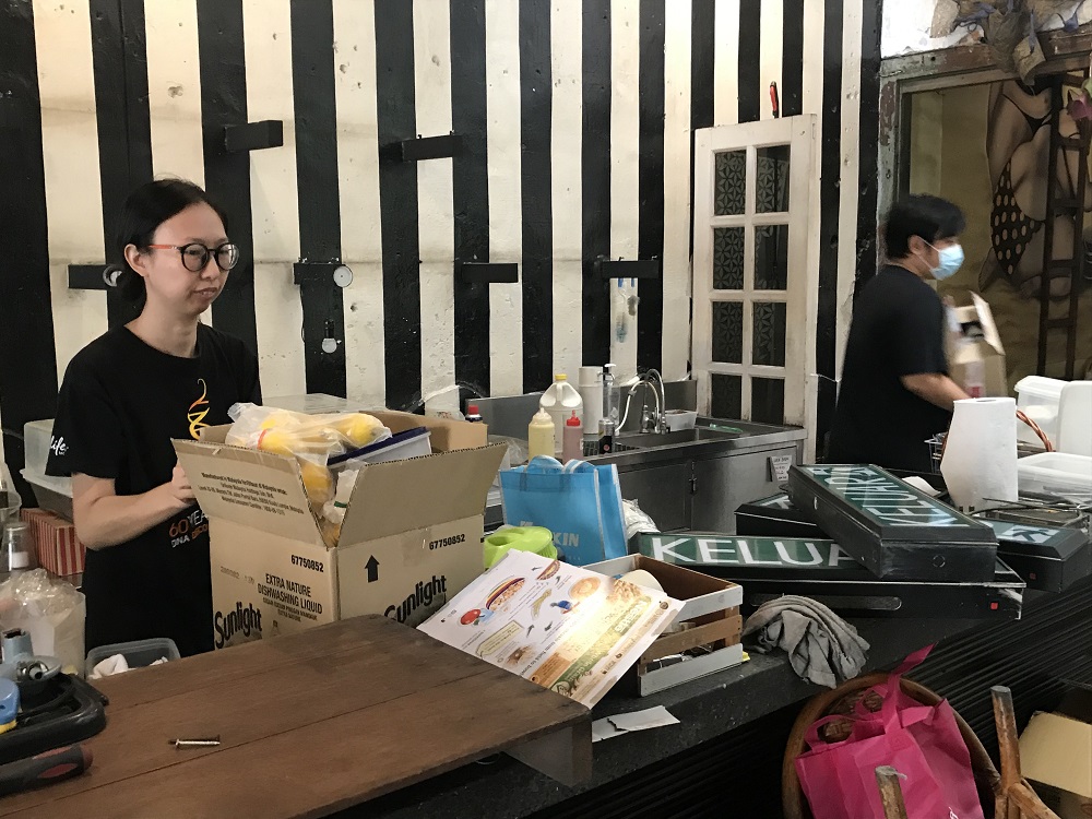 Burps and Giggles' manager Amand Teoh is seen packing up some things as the Ipoh's pioneer hipster cafe will shut down its business temporarily.