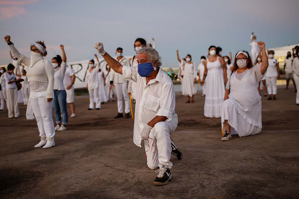 Artists kneel during a protest to honour people who died fromCovid-19 during its outbreak in Brasilia, Brazil June 8, 2020. u00e2u20acu201d Reuters pic