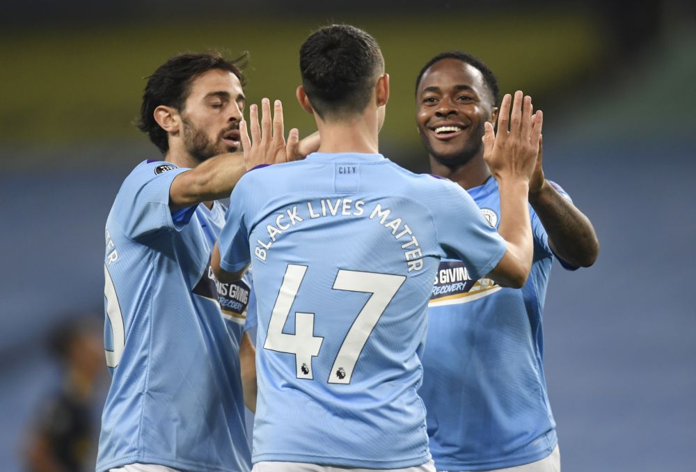 Manchester City's Phil Foden (centre) celebrates scoring against Arsenal with Raheem Sterling and Bernardo Silva at the Etihad Stadium June 17, 2020. u00e2u20acu201d Reuters pic