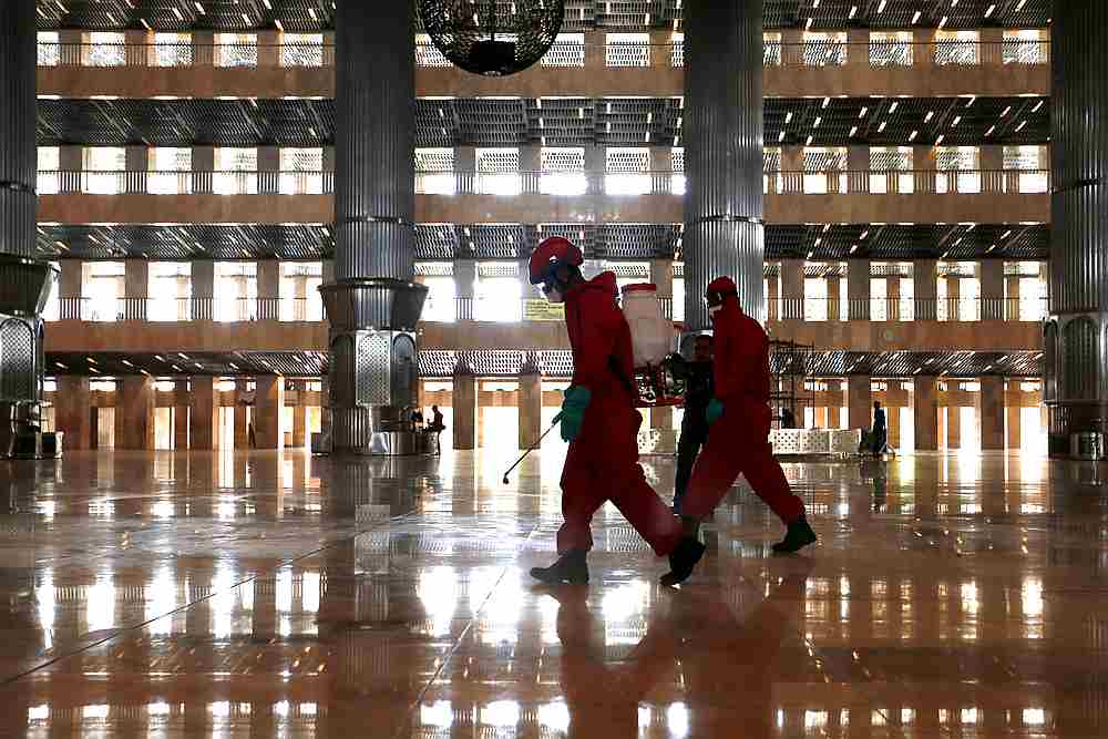 Firefighters wearing protective suits spray disinfectant at a mosque to prevent the spread of the Covid-19 in Jakarta, Indonesia, June 3, 2020. u00e2u20acu201d Reuters pic