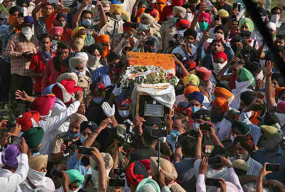 People carry the coffin of Satnam Singh, an Indian soldier who was killed in a border clash with Chinese troops in Ladakh region, in Bhojraj village, Gurdaspur, Punjab India, June 18, 2020. u00e2u20acu201d Reuters pic