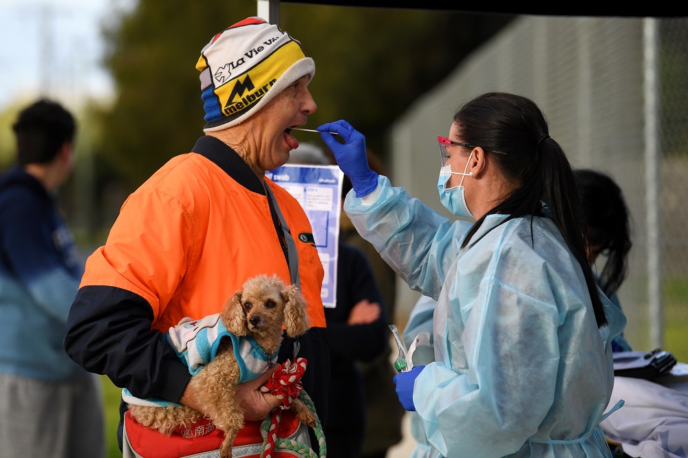 A medical professional administers a test to a member of the public at a pop-up Covid-19 testing facility in Melbourne June 26, 2020. u00e2u20acu2022 Reuters pic