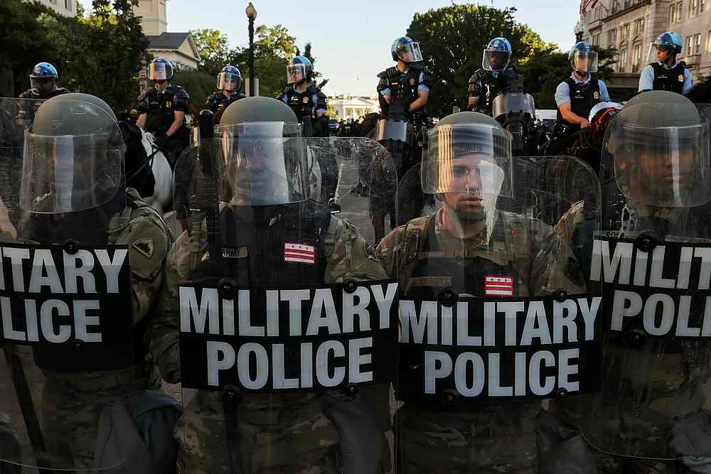 Washington National Guard Military Police officers and law enforcement officers stand guard during a protests near the White House in Washington June 1, 2020. u00e2u20acu201d Reuters pic