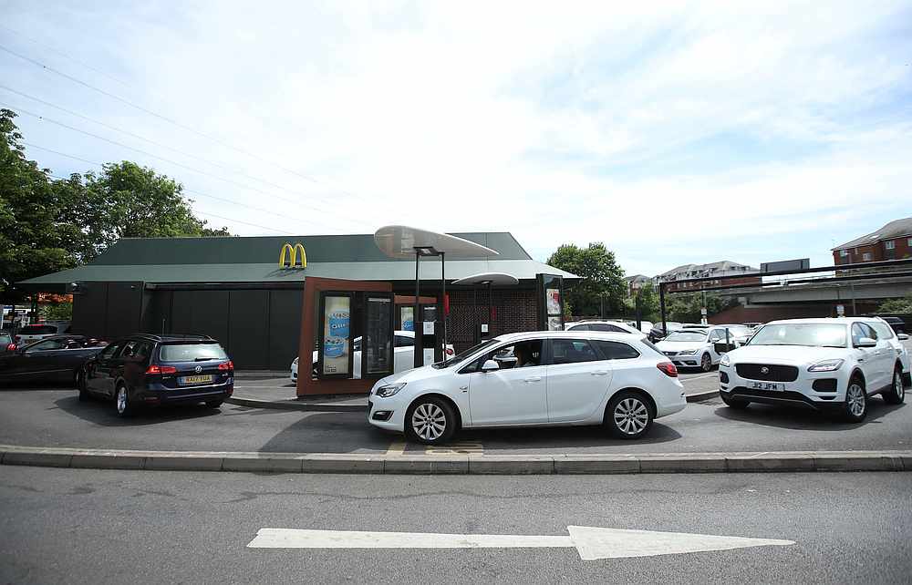 Customers queue in their cars at a McDonald's drive thru in Dunstable, Britain June 2, 2020. u00e2u20acu201d Reuters pic