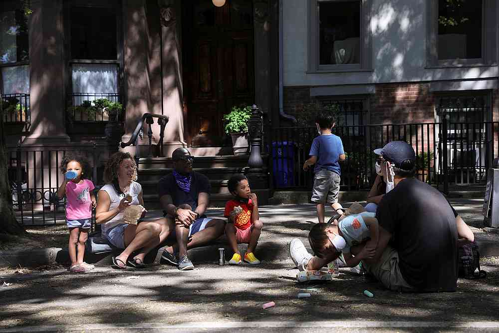 People gather on a closed street in Brooklyn, as phase one of reopening after lockdown begins, during the Covid-19, in New York June 13, 2020. u00e2u20acu201d Reuters pic