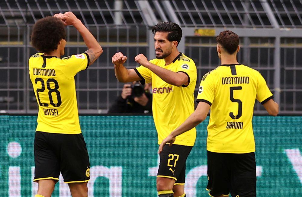 Borussia Dortmundu00e2u20acu2122s Emre Can celebrates scoring their first goal against Hertha Berlin at the Signal Iduna Park, Dortmund June 6, 2020. u00e2u20acu201d Reuters picnn