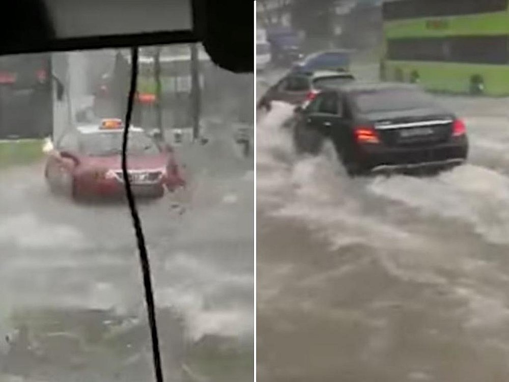 Videos posted on social media June 23 show vehicles attempting to drive through waterlogged roads in several parts of Singapore. u00e2u20acu201d Roads.sg screengrab via TODAY