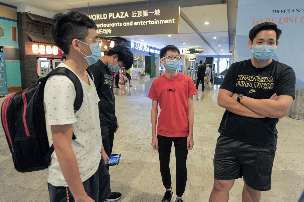 Ryan (in white) and David speak to a reporter during an interview session during the first day of Genting Highlands’ reopening in Pahang, June 19, 2020. 