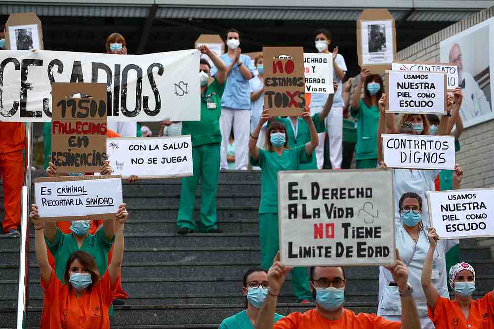 Medical staff members from Gregorio Maranon hospital hold signs during a protest for better working conditions amid the Covid-19 outbreak, in Madrid, Spain June 15, 2020. u00e2u20acu201d Reuters pic
