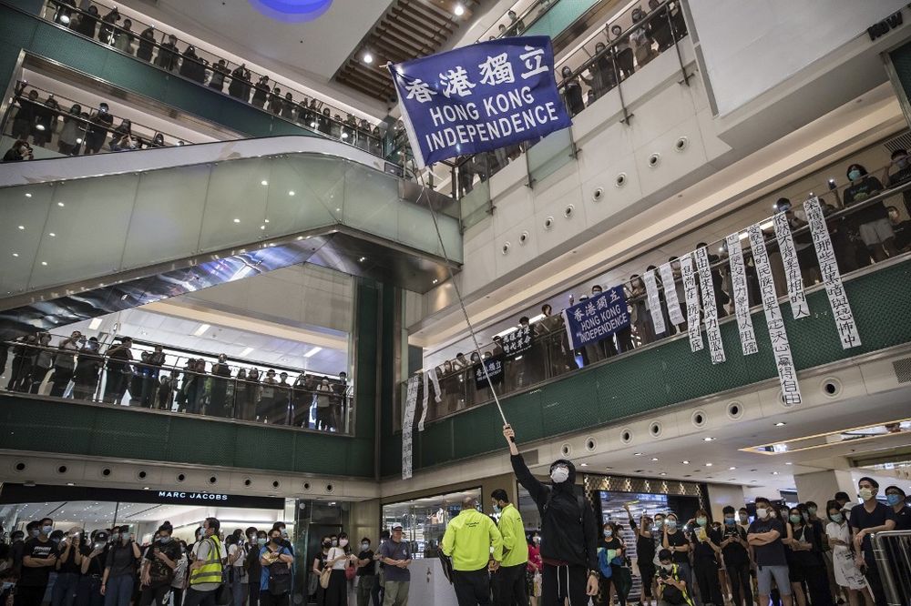Protesters attend a pro-democracy rally at a shopping mall in Hong Kong on June 12, 2020. Thousands of Hong Kongers sang a protest anthem and chanted slogans across the city on June 12 as they marked the one-year anniversary of major clashes between polic