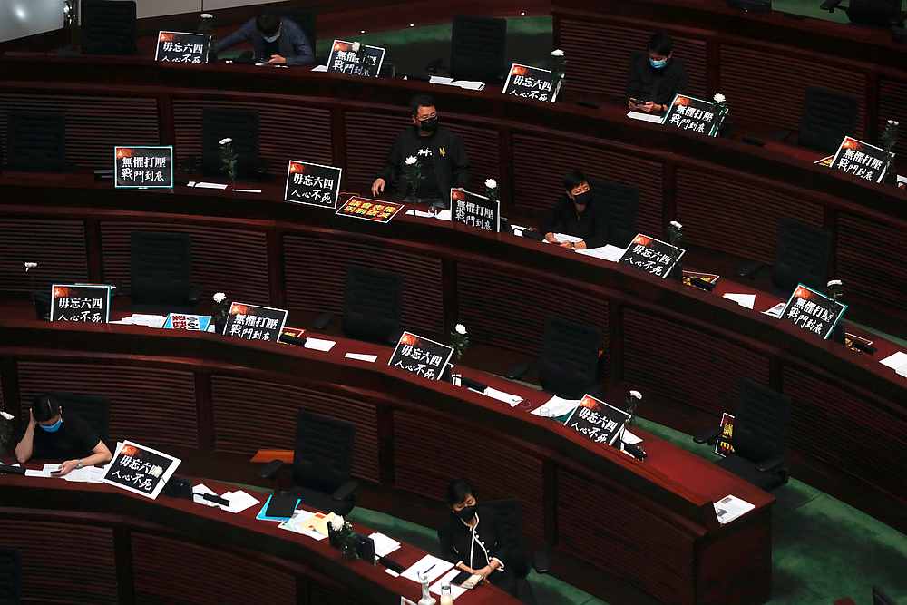 Legislators at a council meeting on the controversial national anthem bill in Hong Kong June 4, 2020. Placards read, 'Never forget June 4,' 'The people's determination is unstoppable' and 'We will not be defeated.' u00e2u20acu201d Reuters pic