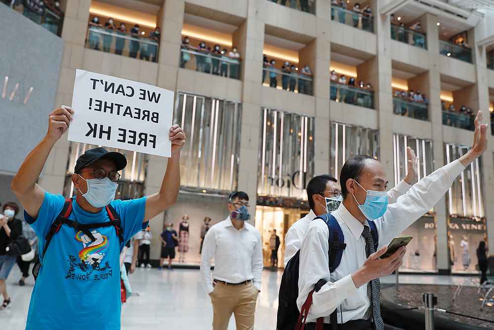 Pro-democracy demonstrators stage a rally for the first anniversary of a mass rally against the now-withdrawn extradition bill, at a shopping mall in Hong Kong June 9, 2020. u00e2u20acu201d Reuters pic