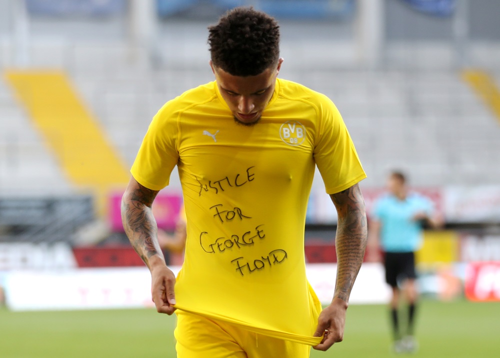 Borussia Dortmund's Jadon Sancho celebrates scoring the second goal with a 'Justice for George Floyd' shirt, June 1, 2020. u00e2u20acu2022 Reuters pic