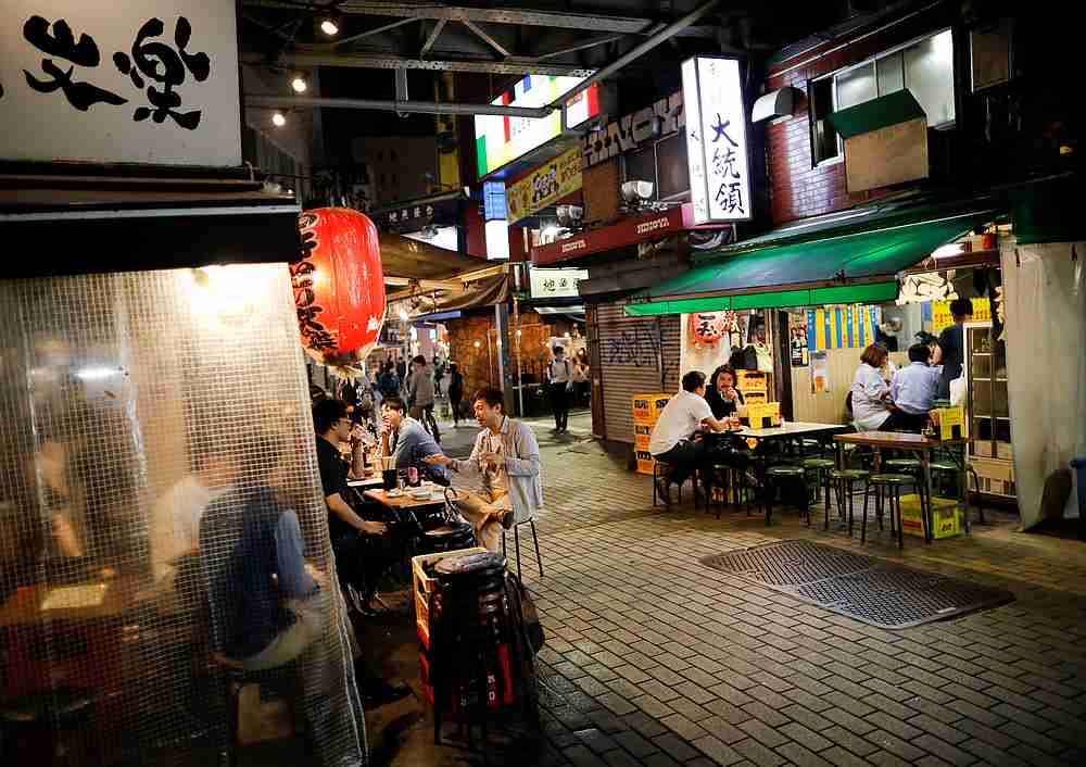 People enjoy drinks and dinner at a Japanese izakaya pub after the Japanese government lifted the state of emergency, at Ueno shopping and amusement district in Tokyo, Japan May 26, 2020. u00e2u20acu201d Reuters pic