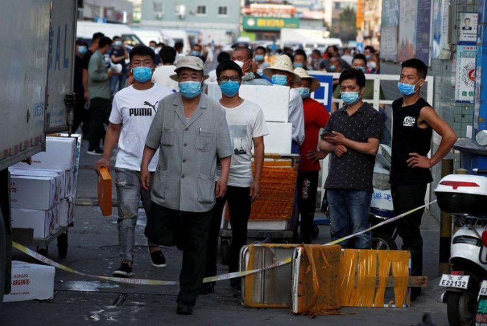People are wearing face masks inside the Jingshen seafood market which has been closed for business after new coronavirus infections were detected, in Beijing, China, June 12, 2020. u00e2u20acu201d Reuters pic