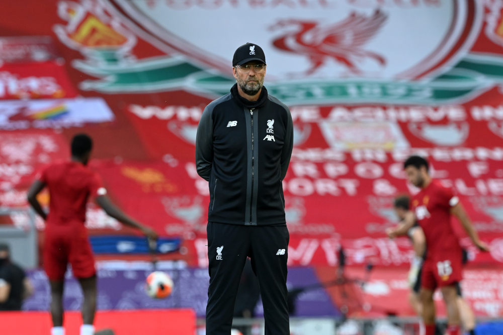 Liverpoolu00e2u20acu2122s German manager Jurgen Klopp watches his players warm up ahead of the English Premier League football match between Liverpool and Crystal Palace at Anfield in Liverpool, north-west England on June 24, 2020. u00e2u20acu201d AFP pic 