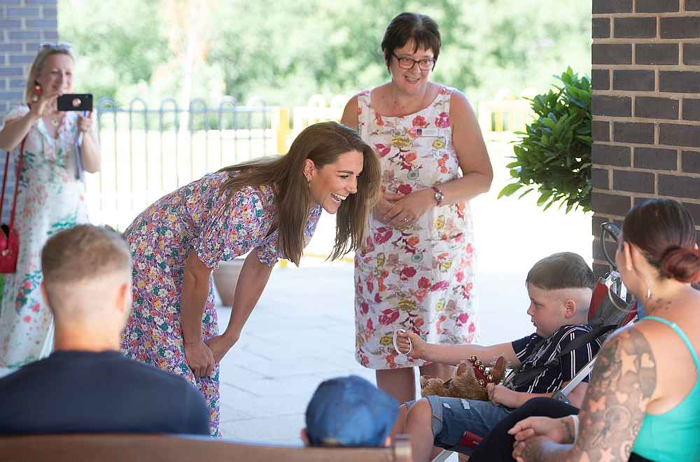 Britain's Catherine, Duchess of Cambridge, meets Sonny Saunders, his mother Kelly (right) and father Jordan (left) in Framingham Earl, Norfolk, Britain June 25, 2020. u00e2u20acu201d Joe Giddens/Pool pic via Reuters