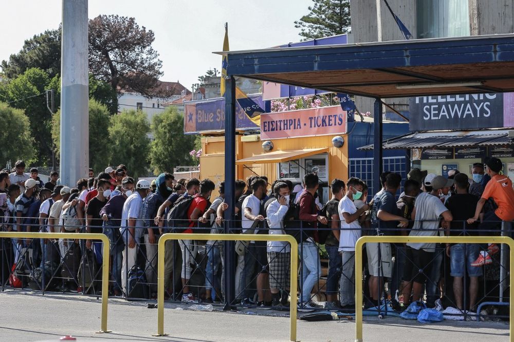 Migrants line up at the ticket desks of the port of Mytilene in the island of Lesbos after receiving a paper for free movement in the mainland of Greece, on June 10, 2020. u00e2u20acu201d AFP pic