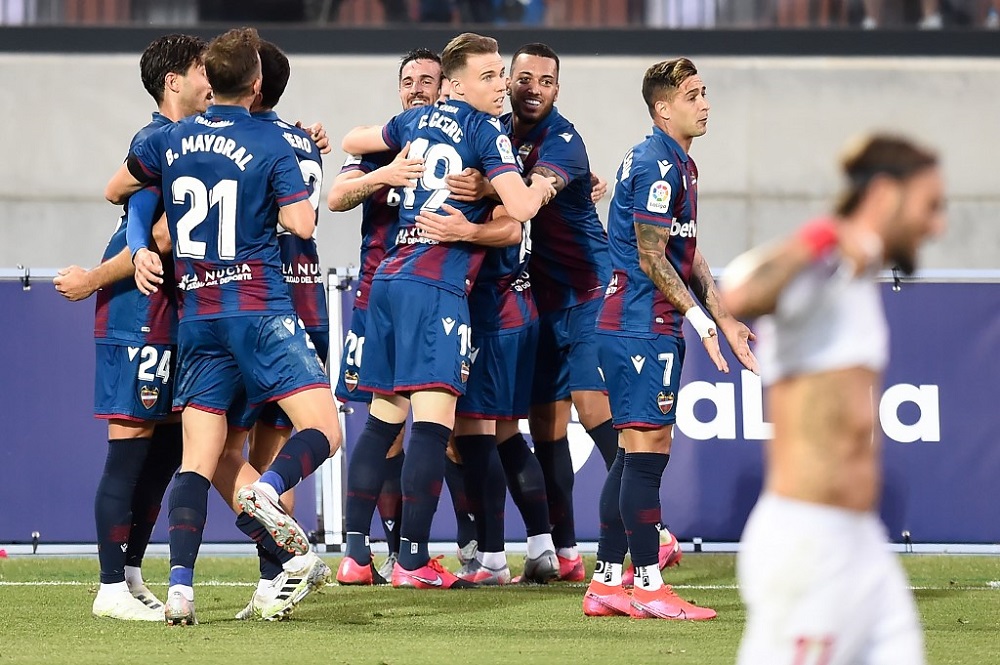 Levante's players celebrate Sevilla's own goal at the Ciutat de Valencia stadium in Valencia, on June 16, 2020. u00e2u20acu2022 AFP pic