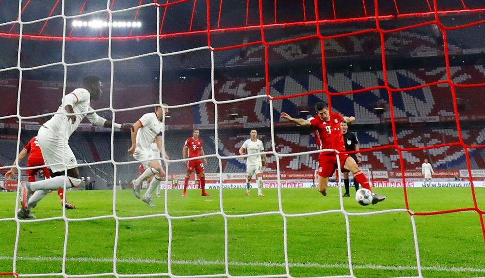Bayern Munich's Robert Lewandowski scores their second goal against Eintracht Frankfurt at the Allianz Arena in Munich June 10, 2020.u00e2u20acu201d Reuters picnn