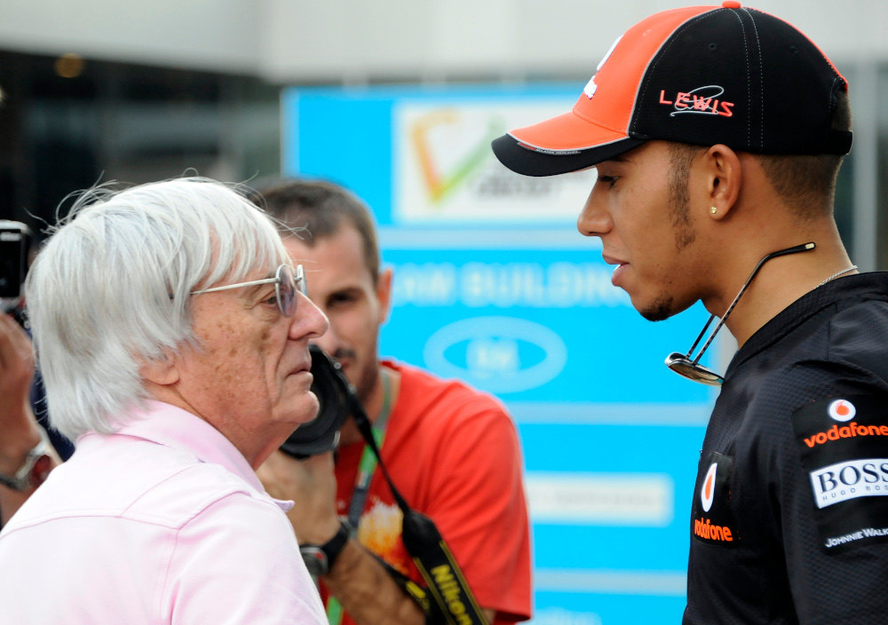 McLaren-Mercedes driver Lewis Hamilton of Britain speaks with Bernie Ecclestone at the paddock one day before the practice sessions of Formula Oneu00e2u20acu2122s Indian Grand Prix at the Buddh International circuit in Greater Noida. u00e2u20acu201d AFP pic 