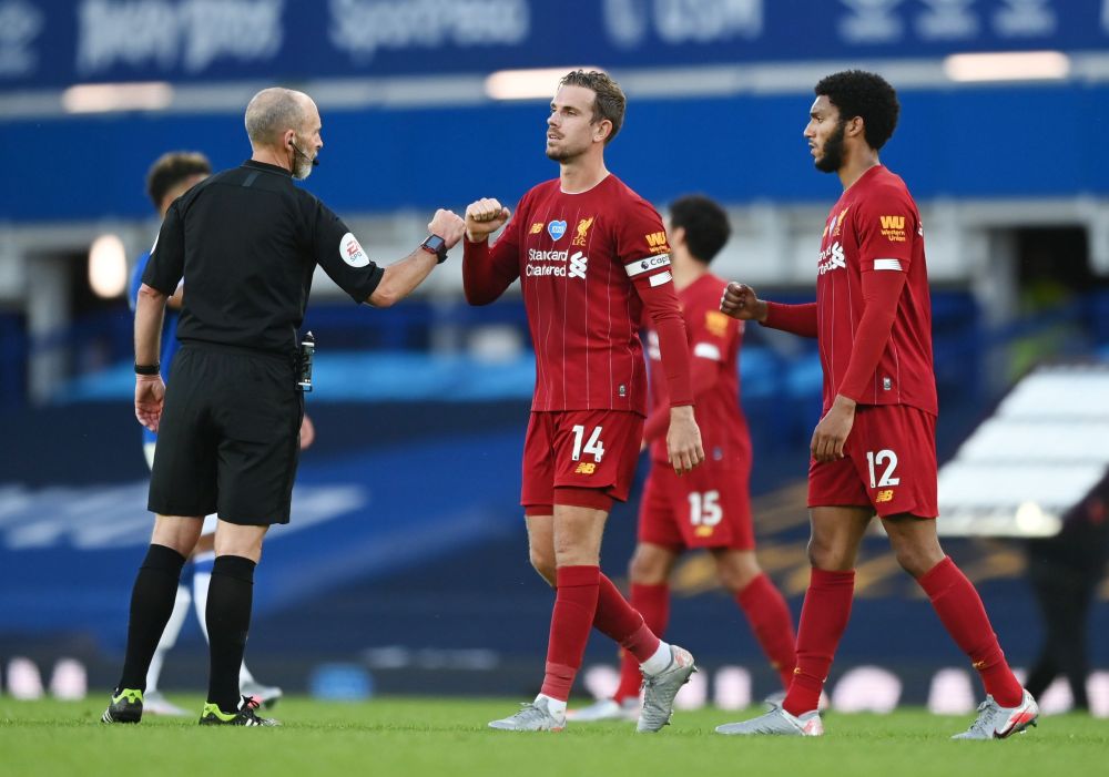 Liverpool's Jordan Henderson bumps fists with referee Mike Dean after the match against Everton at Goodison Park, Liverpool June 21, 2020. u00e2u20acu201d Reuters pic