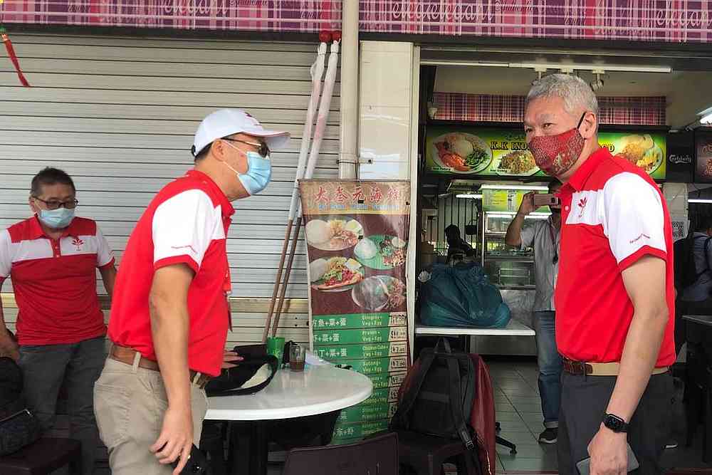 Lee Hsien Yang (right) with other PSP members at a coffee shop in Singapore June 30, 2020. u00e2u20acu201d TODAY pic