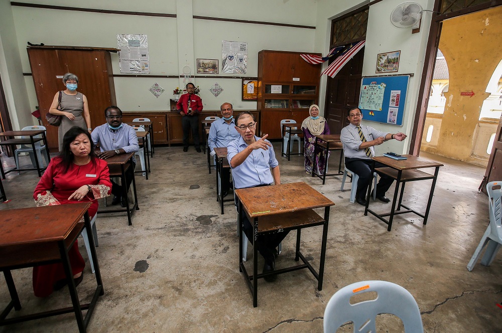 Deputy Education Minister Datuk Dr Mah Hang Soon conducts an inspection on Sekolah Menengah Kebangsaan Main Convent in Ipoh before the school reopens, June 23, 2020. 