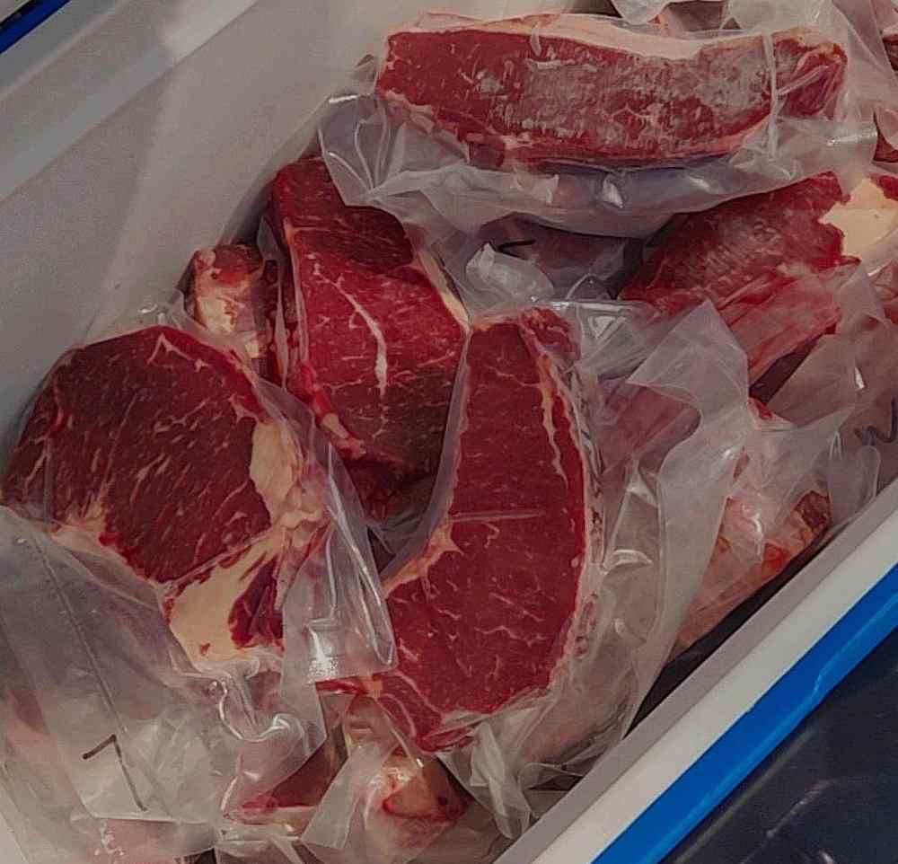 Afiq joined in with his captain in selling New Zealand steaks. — Picture courtesy of Afiq Mohamaad