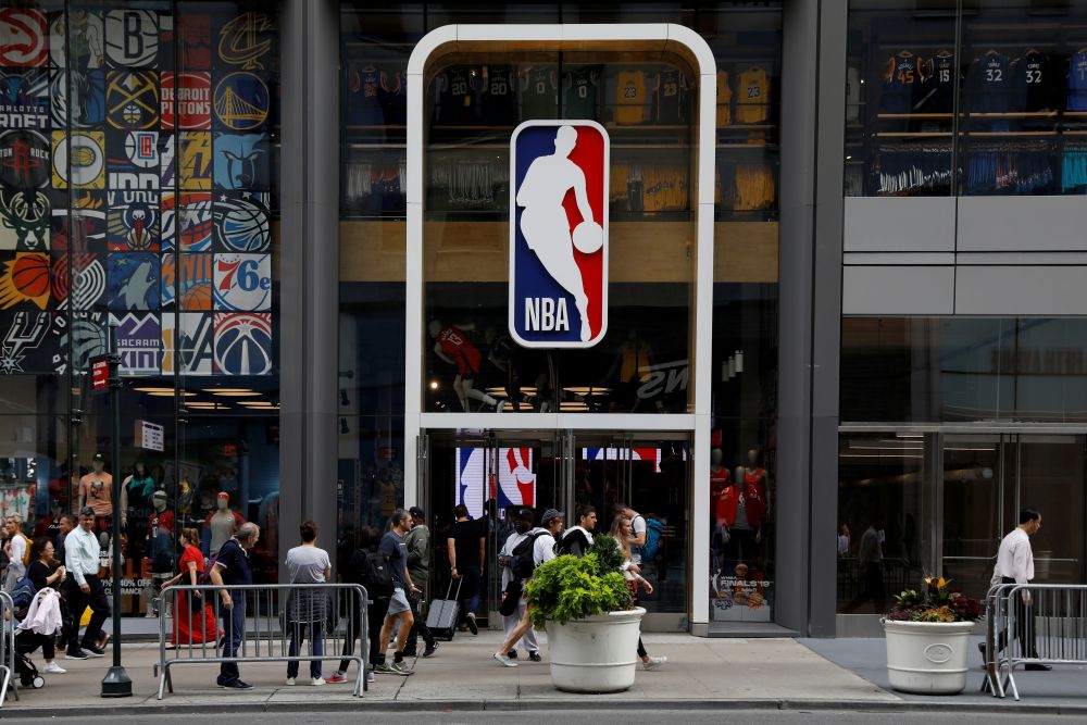 The NBA logo is displayed as people pass by the NBA Store in New York City October 7, 2019. u00e2u20acu201d Reuters pic