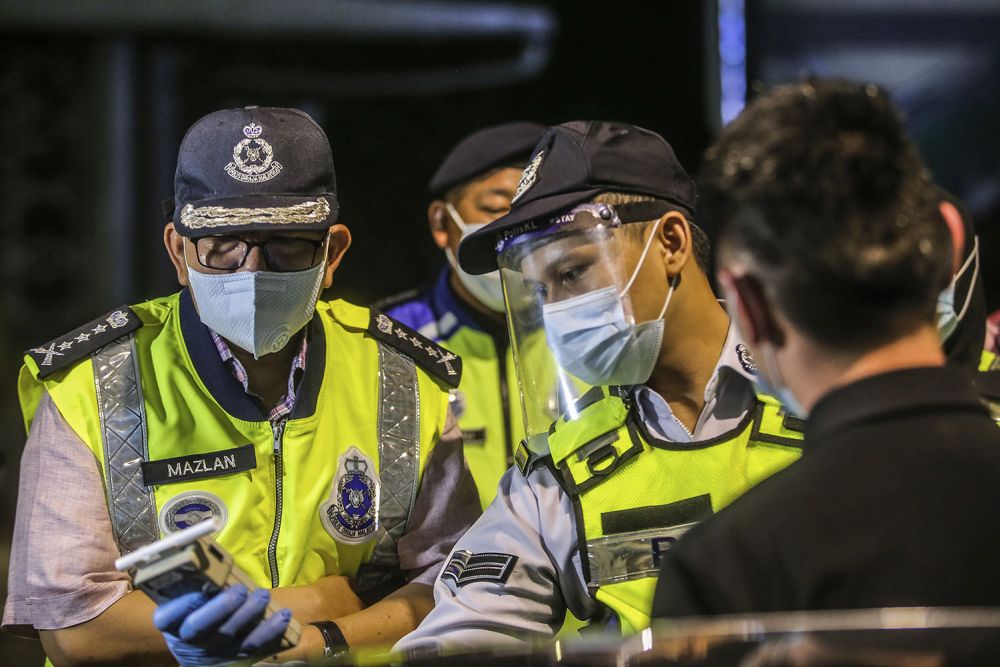 Kuala Lumpur police chief Datuk Seri Mazlan Lazim (left) is pictured at a police roadblock on Jalan Hang Tuah in Kuala Lumpur June 3, 2020. u00e2u20acu201d Picture by Hari Anggara 