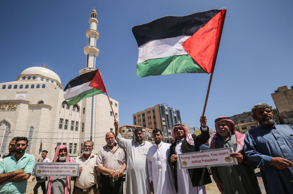 Palestinian protesters take part in a demonstration against Israelu00e2u20acu2122s plans to annex parts of the occupied West Bank, in Khan Yunis in the southern Gaza Strip on June 23, 2020. u00e2u20acu201d AFP pic 