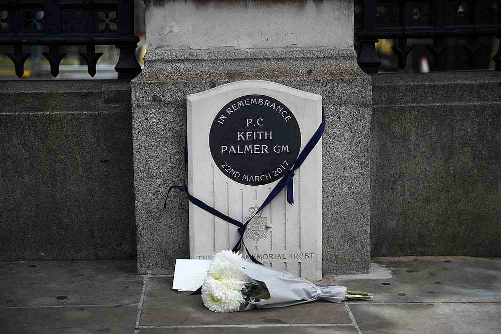 A bouquet of flowers is laid down at the memorial stone for PC Keith Palmer in London, Britain June 14, 2020. u00e2u20acu201d Reuters pic