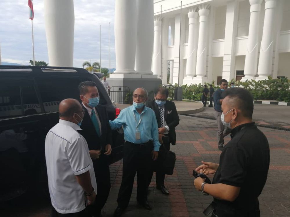Datuk Peter Anthony (second from left) arrives at the Kota Kinabalu Court June 11, 2020. u00e2u20acu201d Picture via Twitter
