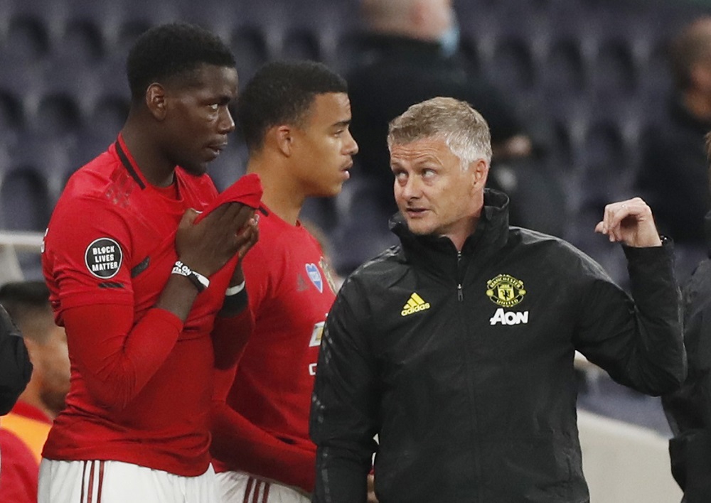 Manchester United manager Ole Gunnar Solskjaer talks to Paul Pogba as he prepares to come on against Tottenham Hotspur June 20, 2020. u00e2u20acu2022 Reuters pic