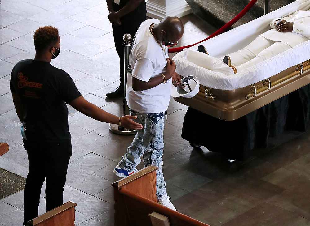 A mourner views the coffin of Rayshard Brooks, a day before his funeral at Ebenezer Baptist Church in Atlanta, Georgia June 22, 2020. u00e2u20acu201d Curtis Compton/Pool pic via Reuters