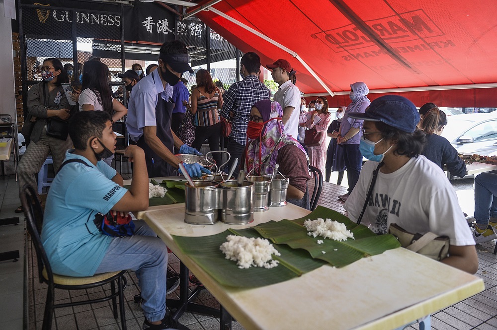 Customers are pictured dining at the Sri Nirwana Maju banana leaf restaurant in Bangsar June 20, 2020. ― Picture by Miera Zulyana