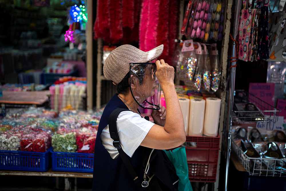 A woman wearing a face shield shops inside the Sampheng wholesale market, as Thai government eases Covid-19 isolation measures, in Bangkok, Thailand June 10, 2020. u00e2u20acu201d Reuters pic