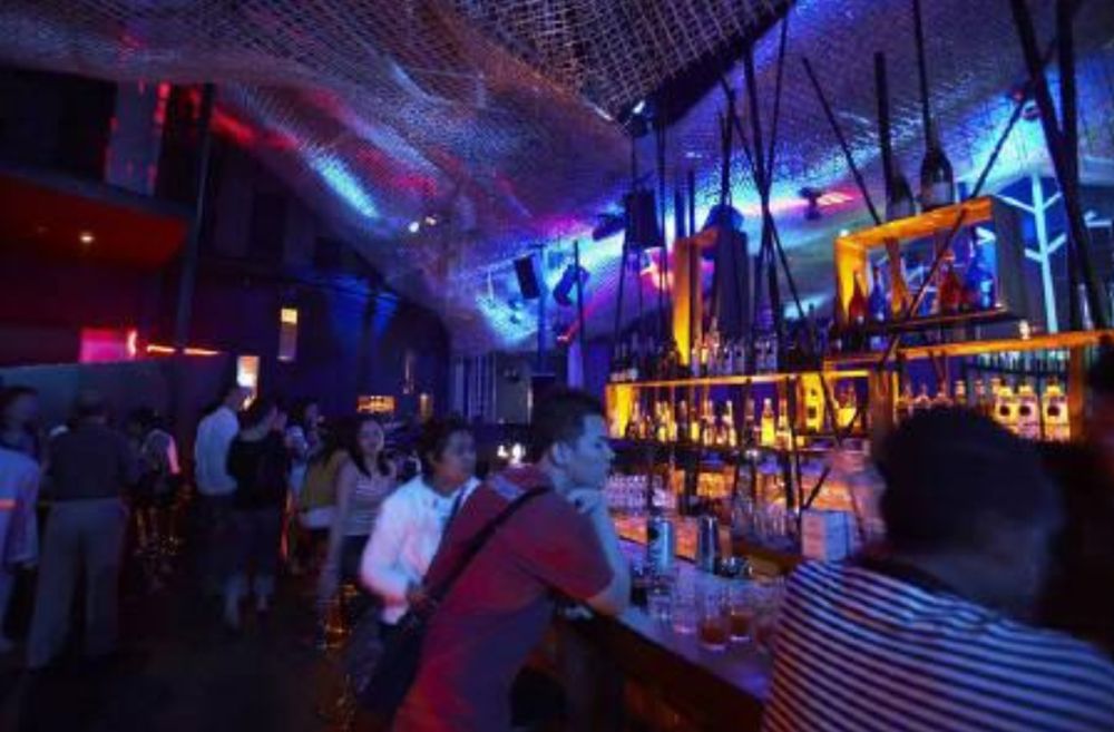 File picture shows party -goers crowding near a bar at St James Power Station in Singapore, December 14, 2006. u00e2u20acu201d Reuters pic