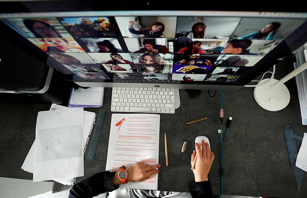 A student takes classes online with his companions using the Zoom app at home in El Masnou, north of Barcelona, Spain April 2, 2020. u00e2u20acu201d Reuters pic