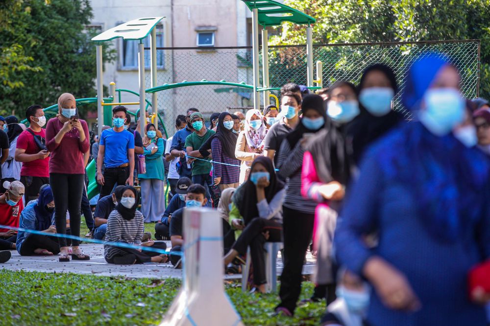 Taman Langat Utama residents queue up to be screened for Covid-19 in Kuala Langat June 3, 2020. u00e2u20acu201d Picture by Hari Anggara 