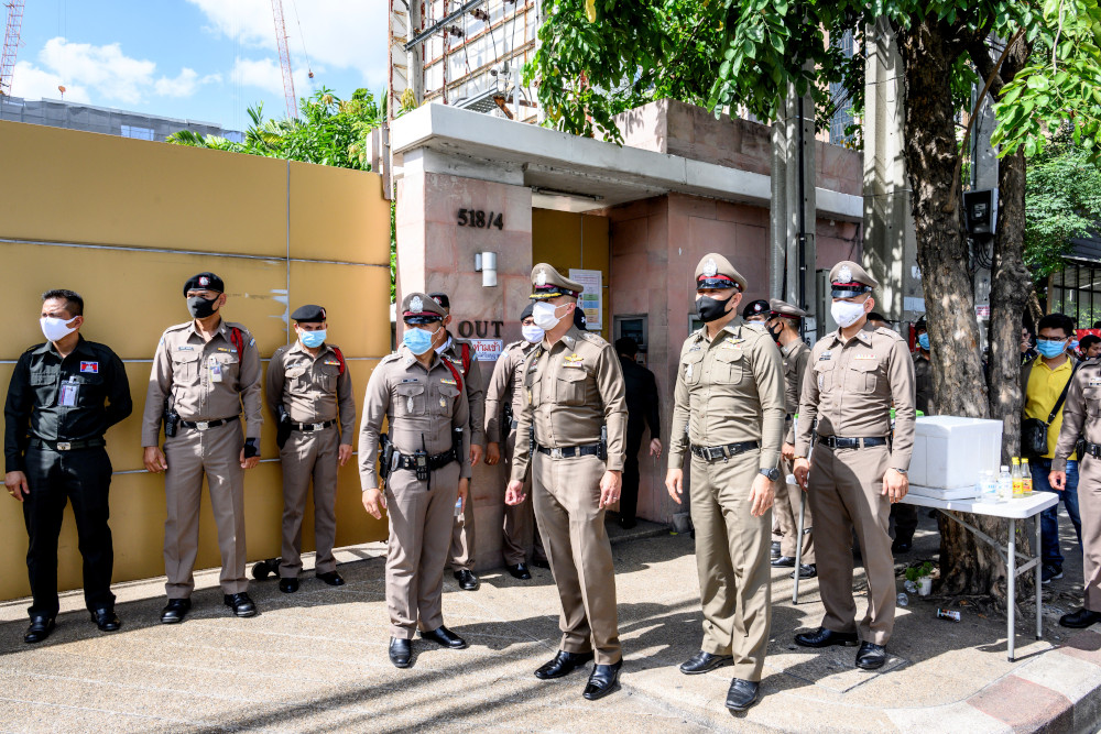 Thai policemen watch a protest demanding the release of allegedly kidnapped Thai activist Wanchalearm Satsaksit outside the Embassy of Cambodia in Bangkok June 8, 2020. u00e2u20acu201d AFP pic 