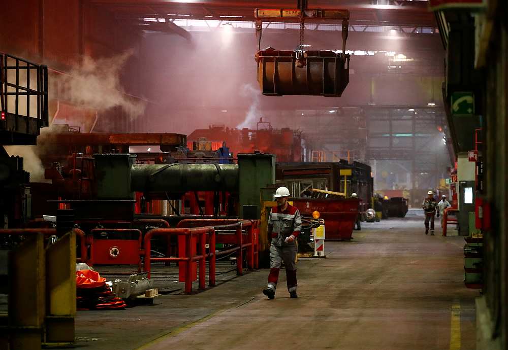 Steel workers of ThyssenKrupp walk through the hall of the rolling mill of its steel factory in Duisburg, Germany January 30, 2020. u00e2u20acu201d Reuters pic