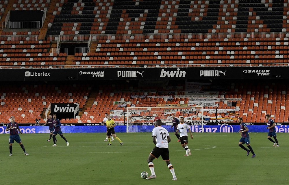 Valencia's French defender Mouctar Diakhaby (centre) controls the ball during the match against Levante at the Mestalla stadium in Valencia on June 13, 2020. u00e2u20acu2022 AFP pic